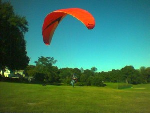 yes, this is a parasail. In a park in Arlington, Mass.